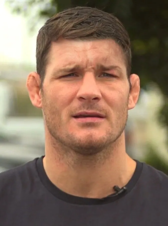 Fighter with one visibly damaged eye speaking to camera