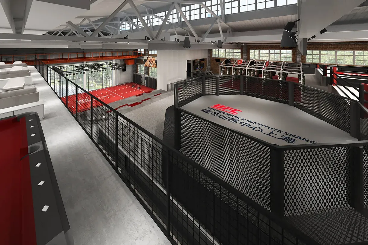 MMA cage set up inside a large converted warehouse gym